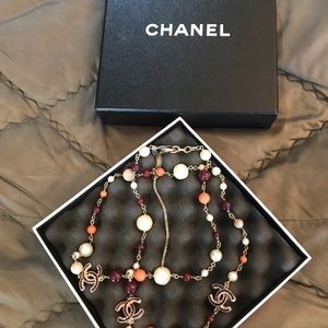 Chanel pearl burgundy n orange necklace.